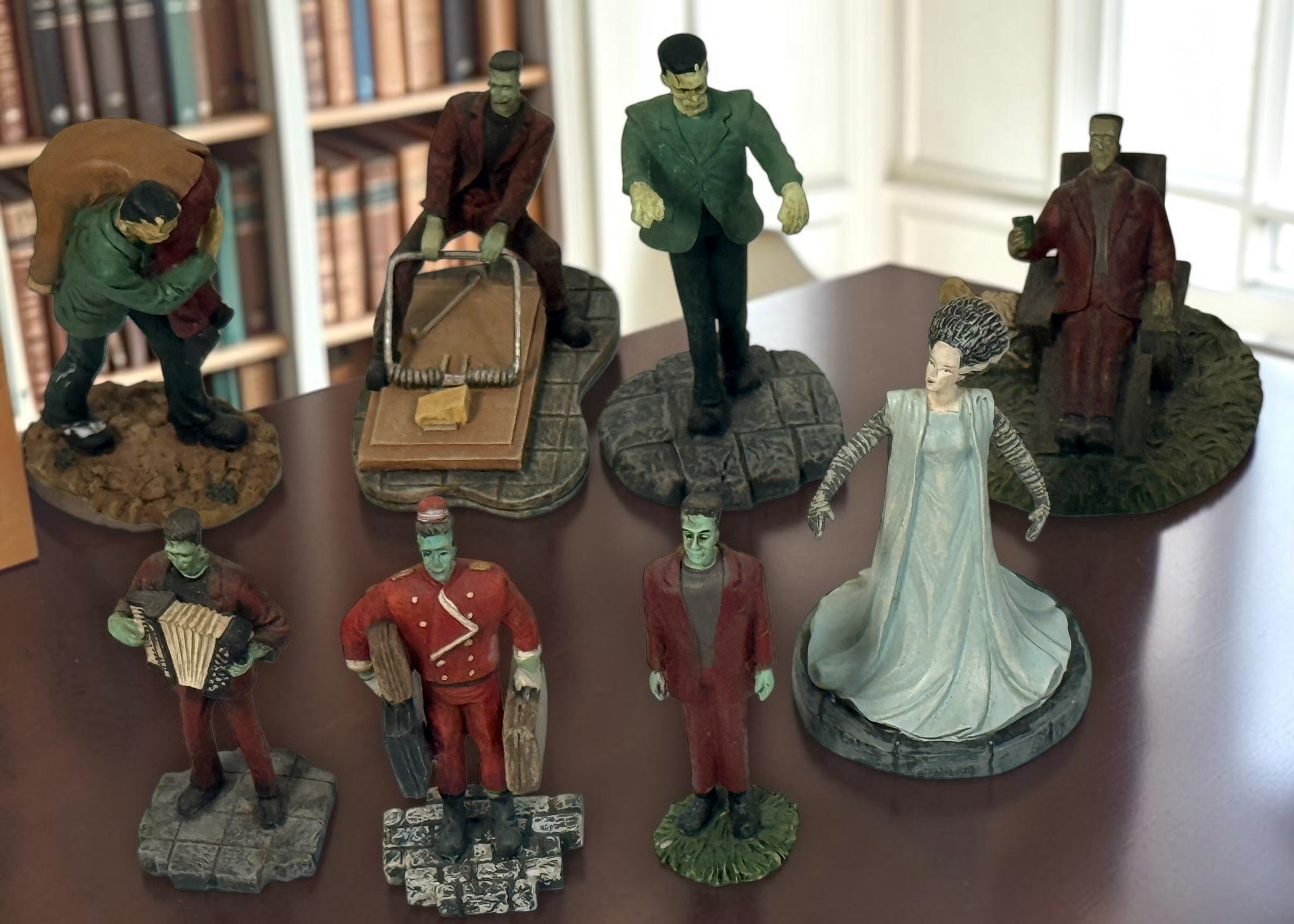 Lot of eight Hawthorne Village Munsters and Universal Monsters resin figurines, including Herman, Bell Hop and Bride of Frankenstein.