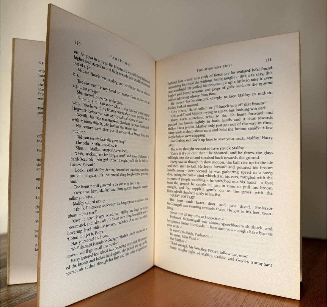 Collectible 1999 Harry Potter Philosopher’s Stone UK deluxe third printing with red cloth binding, gilt page edges and ribbon marker.