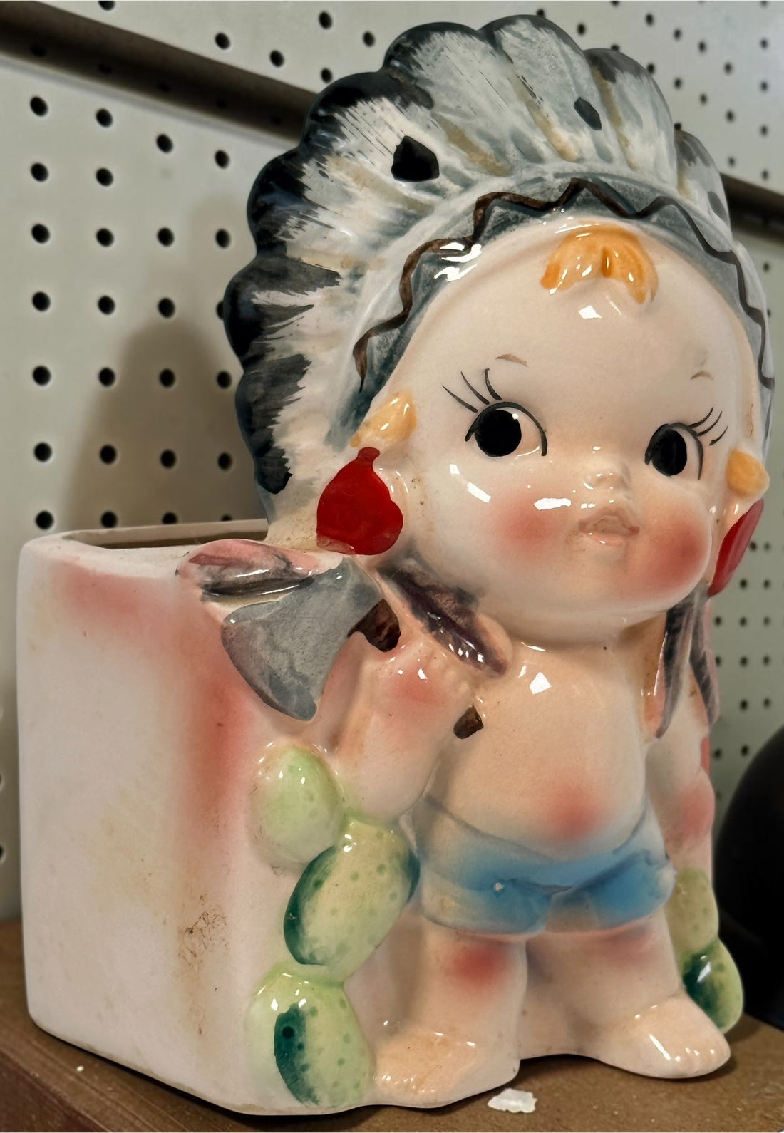 Vintage 1950s Japanese ceramic figural child wall pocket planter with colorful hand-painted decoration, cactus details and original Japan mark.