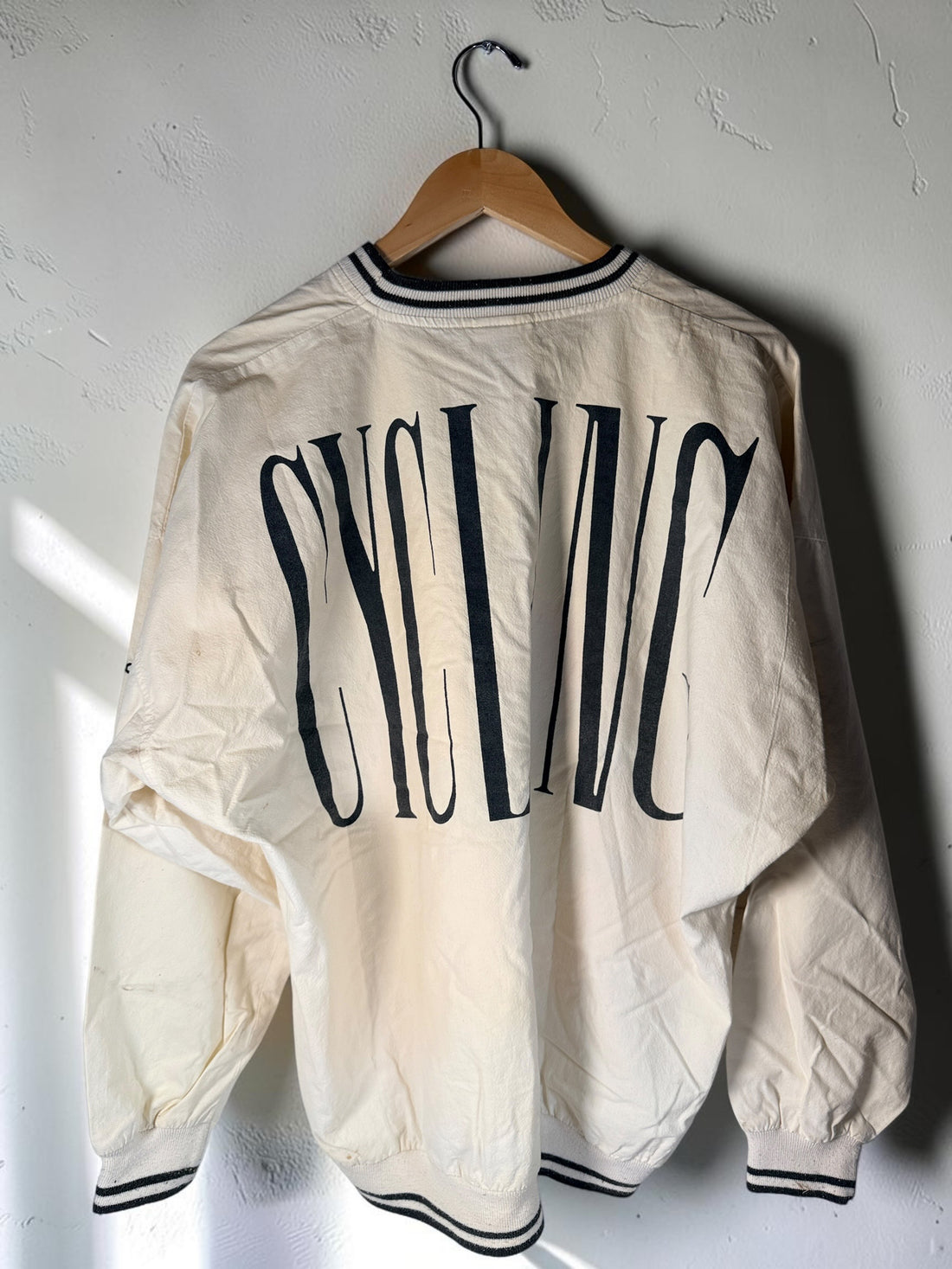 Vintage 80s Adidas cycling pullover in L/XL with bold cyclist graphics and CYCLING back print. 100% cotton. Vintage condition with visible stains.