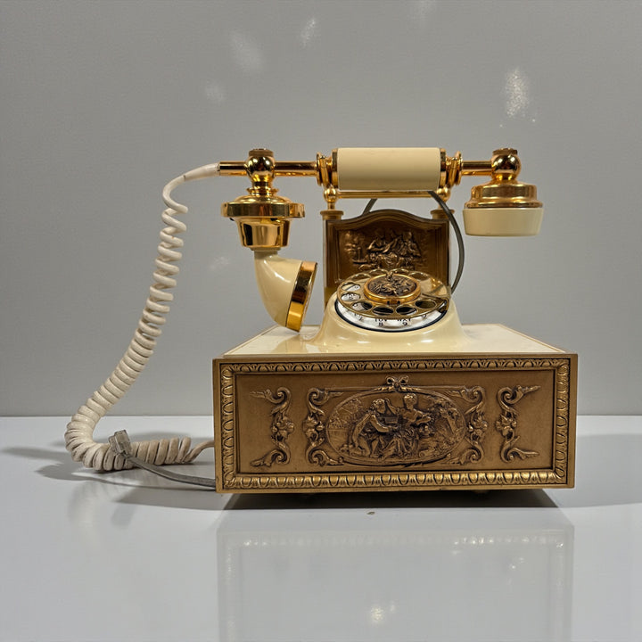Vintage French Victorian style rotary dial phone in cream yellow with brass accents. Ornate cast metal base, tested working, ideal décor statement.