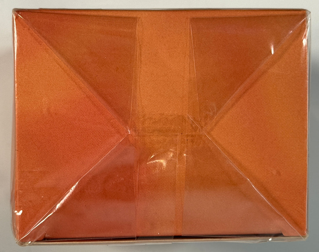 Brown rectangular box with a reflective surface on a gray background