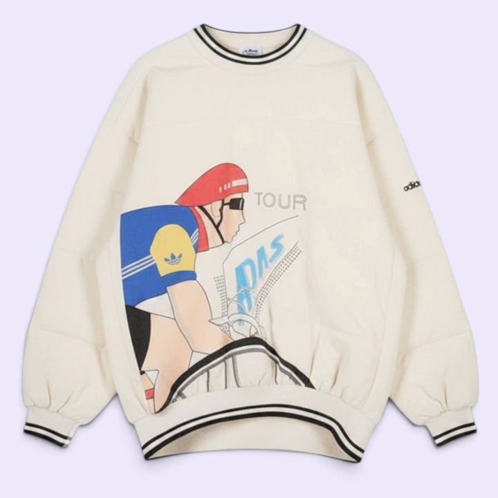 Vintage 80s Adidas cycling pullover in L/XL with bold cyclist graphics and CYCLING back print. 100% cotton. Vintage condition with visible stains.