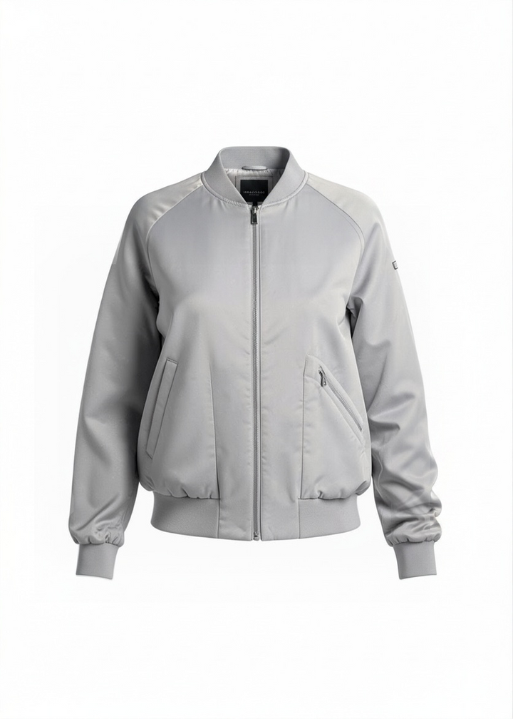 Shop the Marciano Limitless bomber jacket in silver-grey satin, size M. Original tags attached, zip pockets and ribbed trim. Minor marks disclosed.