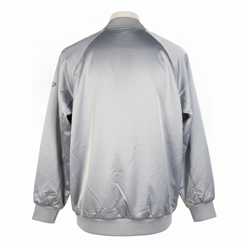 Shop the Marciano Limitless bomber jacket in silver-grey satin, size M. Original tags attached, zip pockets and ribbed trim. Minor marks disclosed.