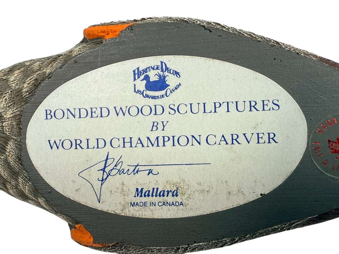 Wooden sculpture with a label indicating 'Bonded Wood Sculptures by World Champion Carver' on a white background.