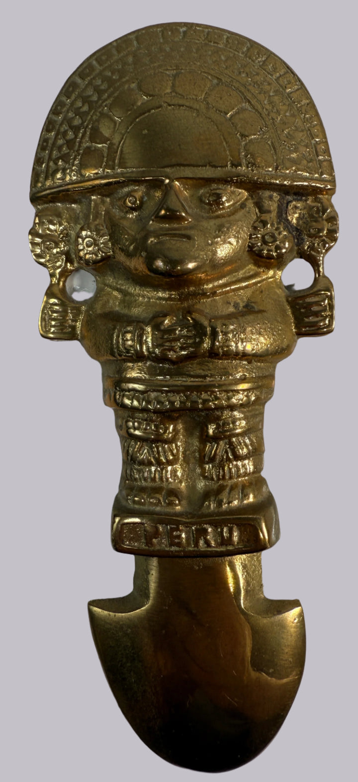 Bronze figurine with a detailed face and headdress on a white background