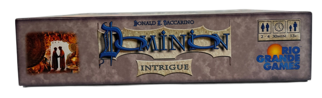 Early 2009 first edition Dominion Intrigue board game expansion. Partial sealed with original box. Classic deck-building strategy by Donald X. Vaccarino.