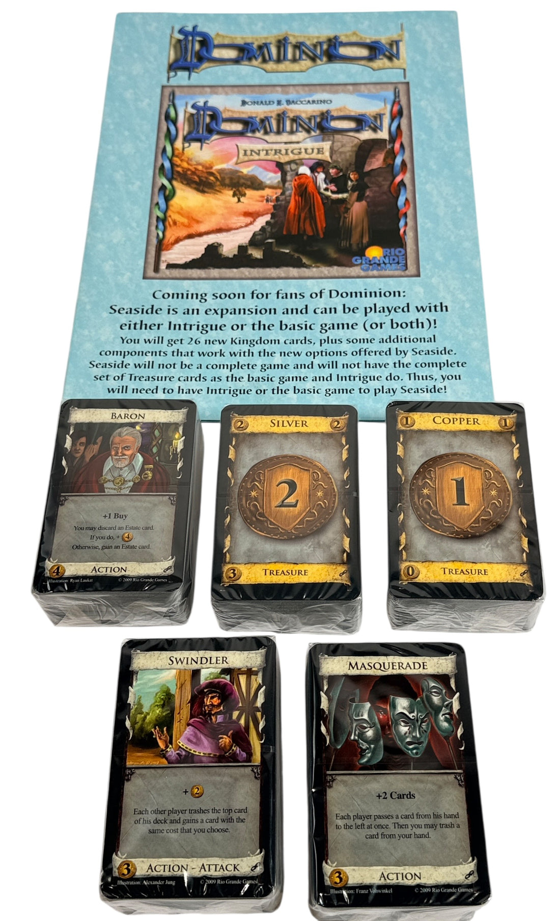 Early 2009 first edition Dominion Intrigue board game expansion. Partial sealed with original box. Classic deck-building strategy by Donald X. Vaccarino.