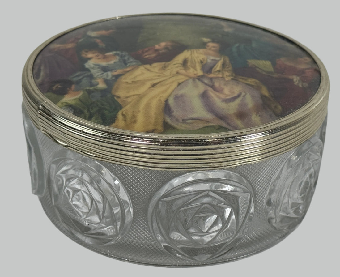 Decorative glass box with intricate designs and a painted lid on a white background