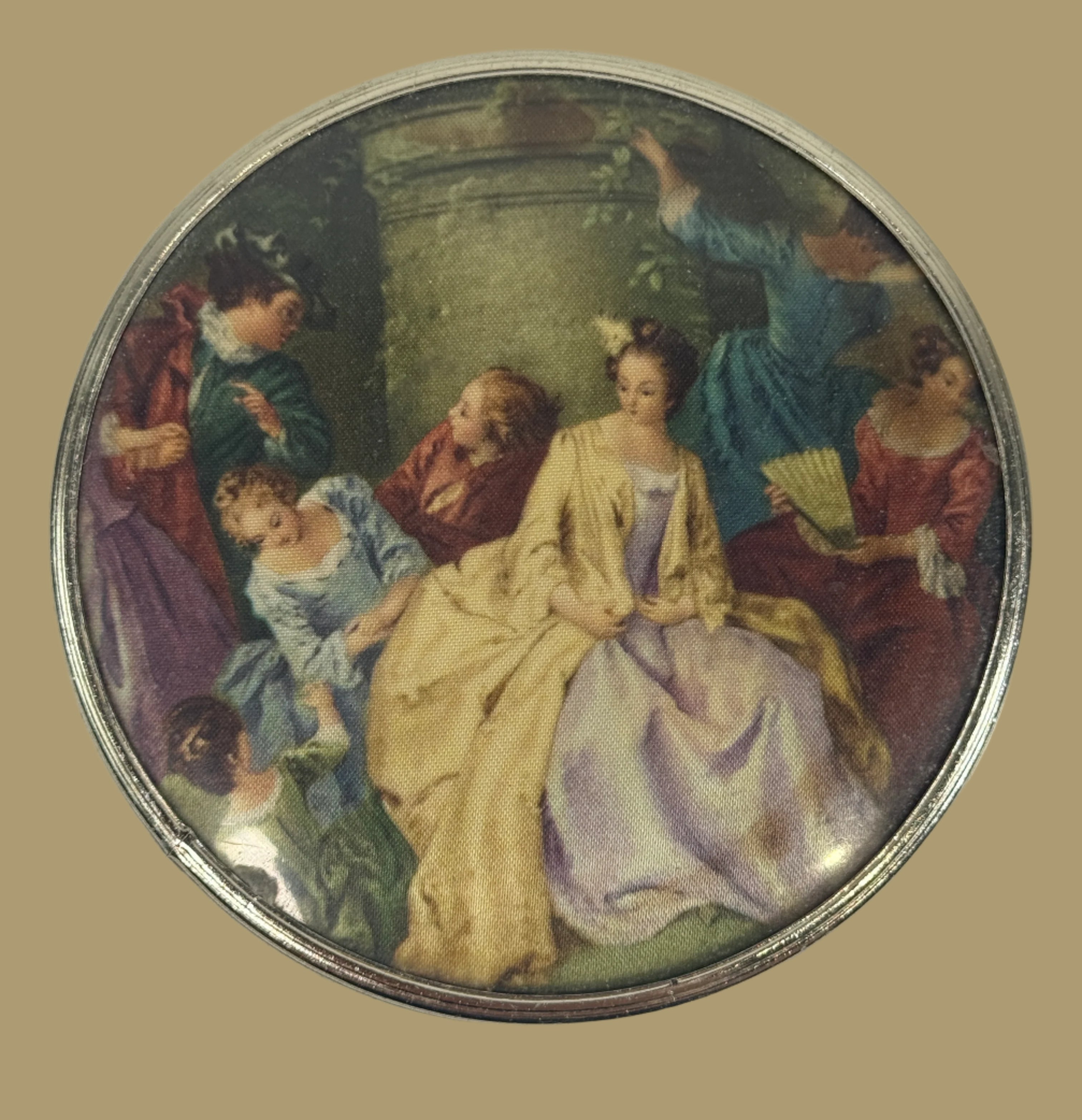Round decorative item with classical painting of a woman in a crowd on a white background