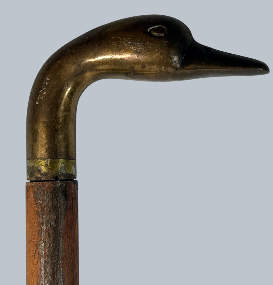 Vintage brass duck head walking cane with 3-piece wooden shaft. Collapsible travel design, aged patina, and classic gentleman’s style.