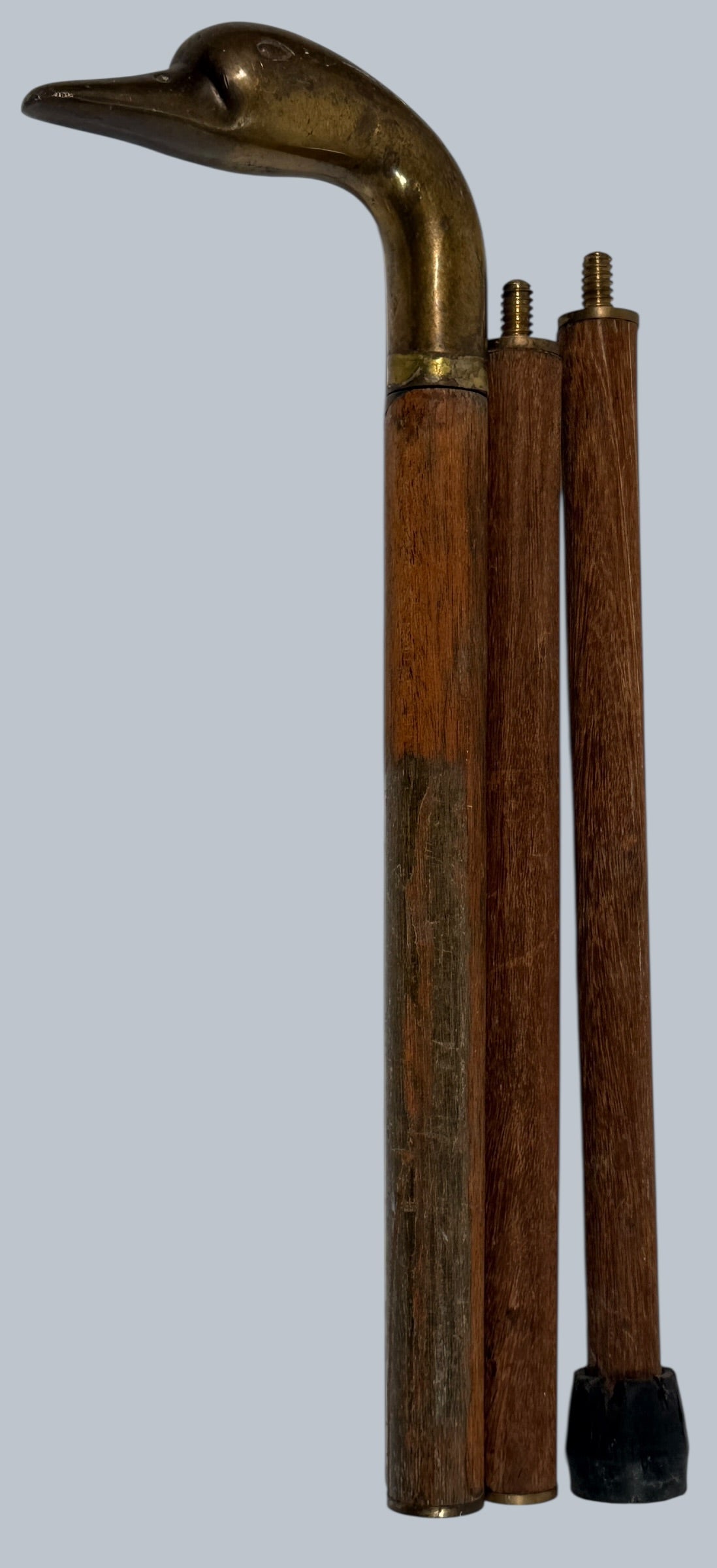 Vintage brass duck head walking cane with 3-piece wooden shaft. Collapsible travel design, aged patina, and classic gentleman’s style.