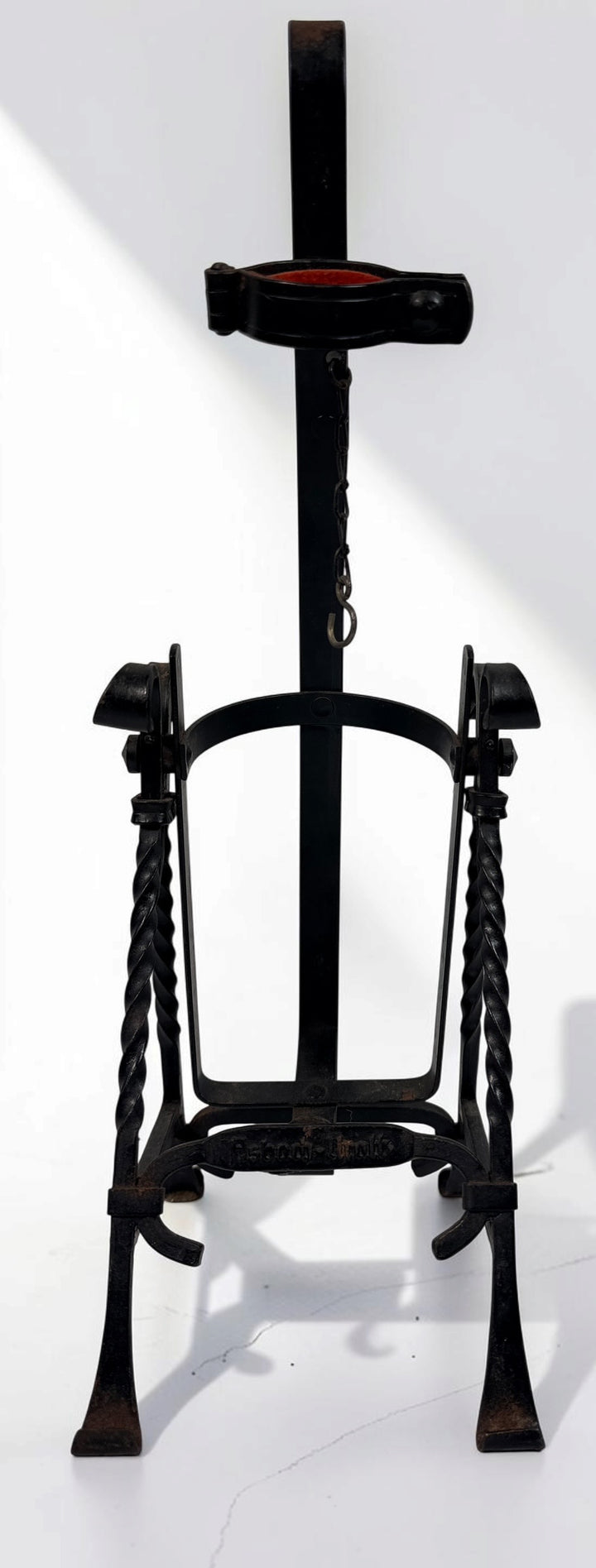 Vintage Asbach Uralt wrought iron German brandy bottle pouring cradle with tilting holder, twisted ironwork and original aged patina. Collectible barware.