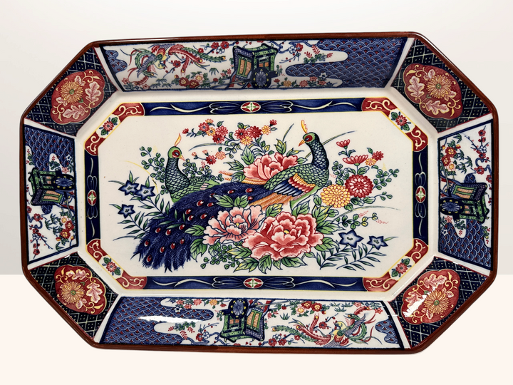 Vintage Japanese Imari-style porcelain serving platter with colourful peacocks, peonies, phoenix birds and traditional floral decoration.