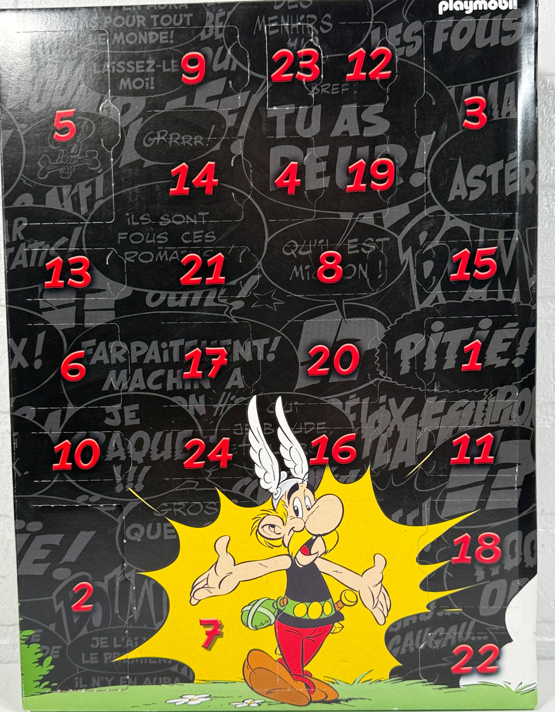 Advent calendar with cartoon character on a black background with visible brand 'playmo' at the top.