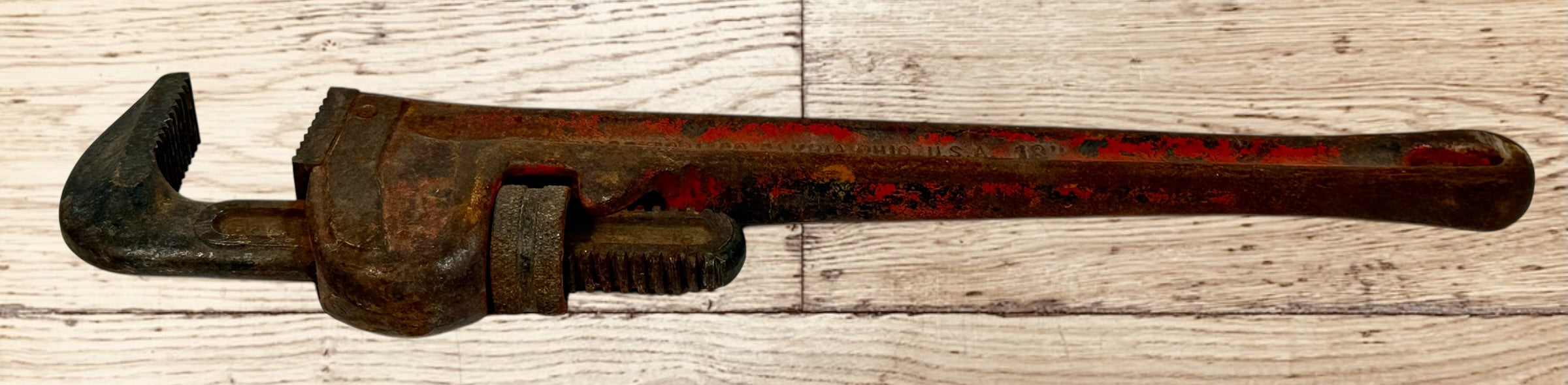 Vintage RIDGID 14 inch pipe wrench made in Elyria Ohio USA. Early industrial hand tool with original patina, ideal for collectors or workshop decor.