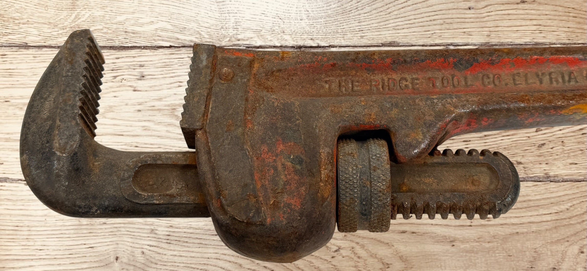 Vintage RIDGID 14 inch pipe wrench made in Elyria Ohio USA. Early industrial hand tool with original patina, ideal for collectors or workshop decor.
