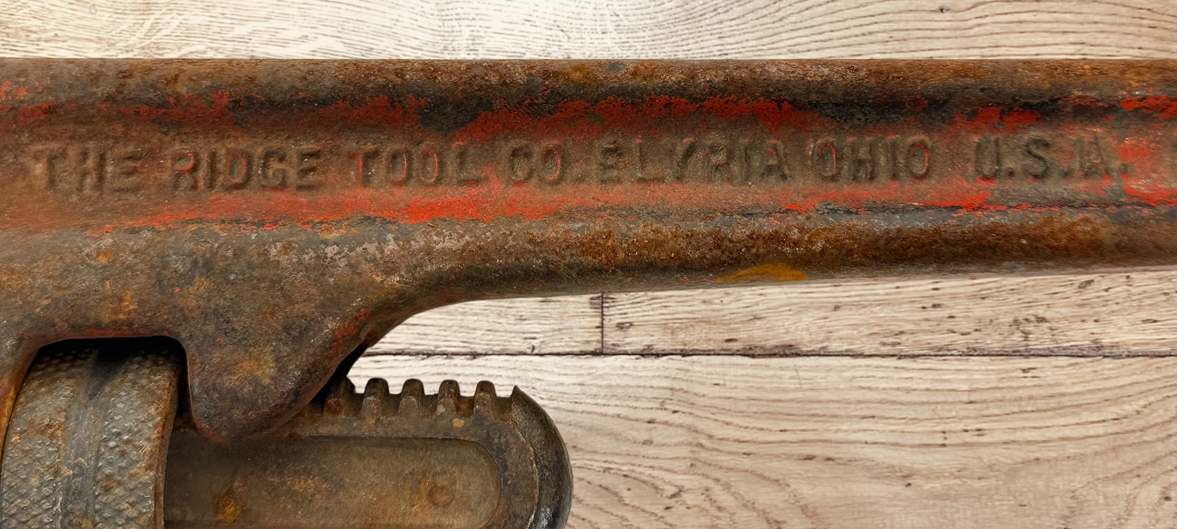 Vintage RIDGID 14 inch pipe wrench made in Elyria Ohio USA. Early industrial hand tool with original patina, ideal for collectors or workshop decor.
