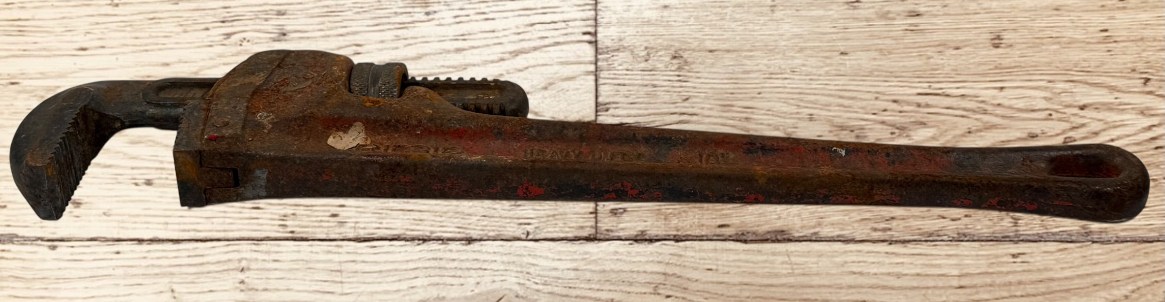 Vintage RIDGID 14 inch pipe wrench made in Elyria Ohio USA. Early industrial hand tool with original patina, ideal for collectors or workshop decor.