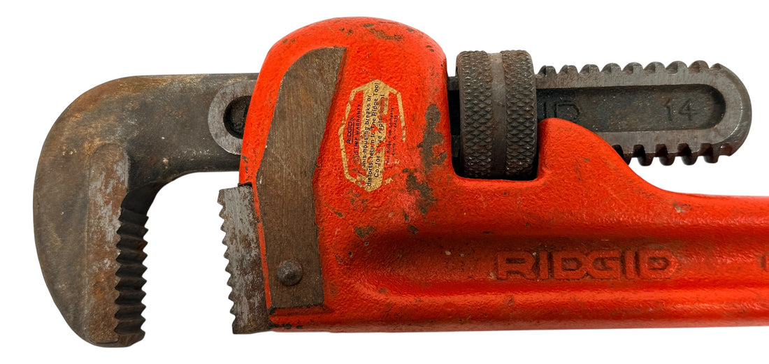 Vintage RIDGID 14 inch pipe wrench made in Elyria, Ohio USA. Heavy duty professional plumbing tool with classic industrial look and solid function.