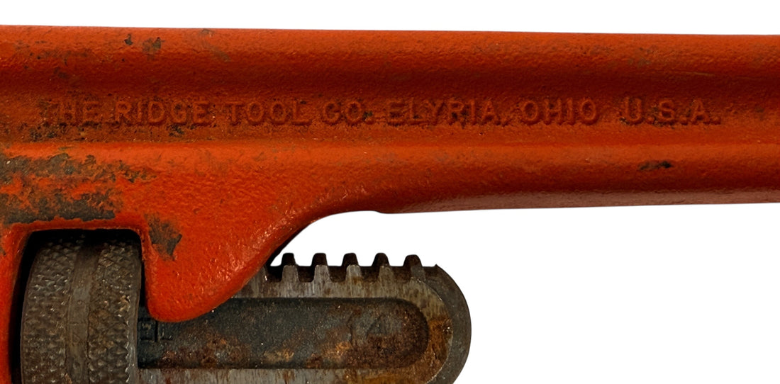 Vintage RIDGID 14 inch pipe wrench made in Elyria, Ohio USA. Heavy duty professional plumbing tool with classic industrial look and solid function.