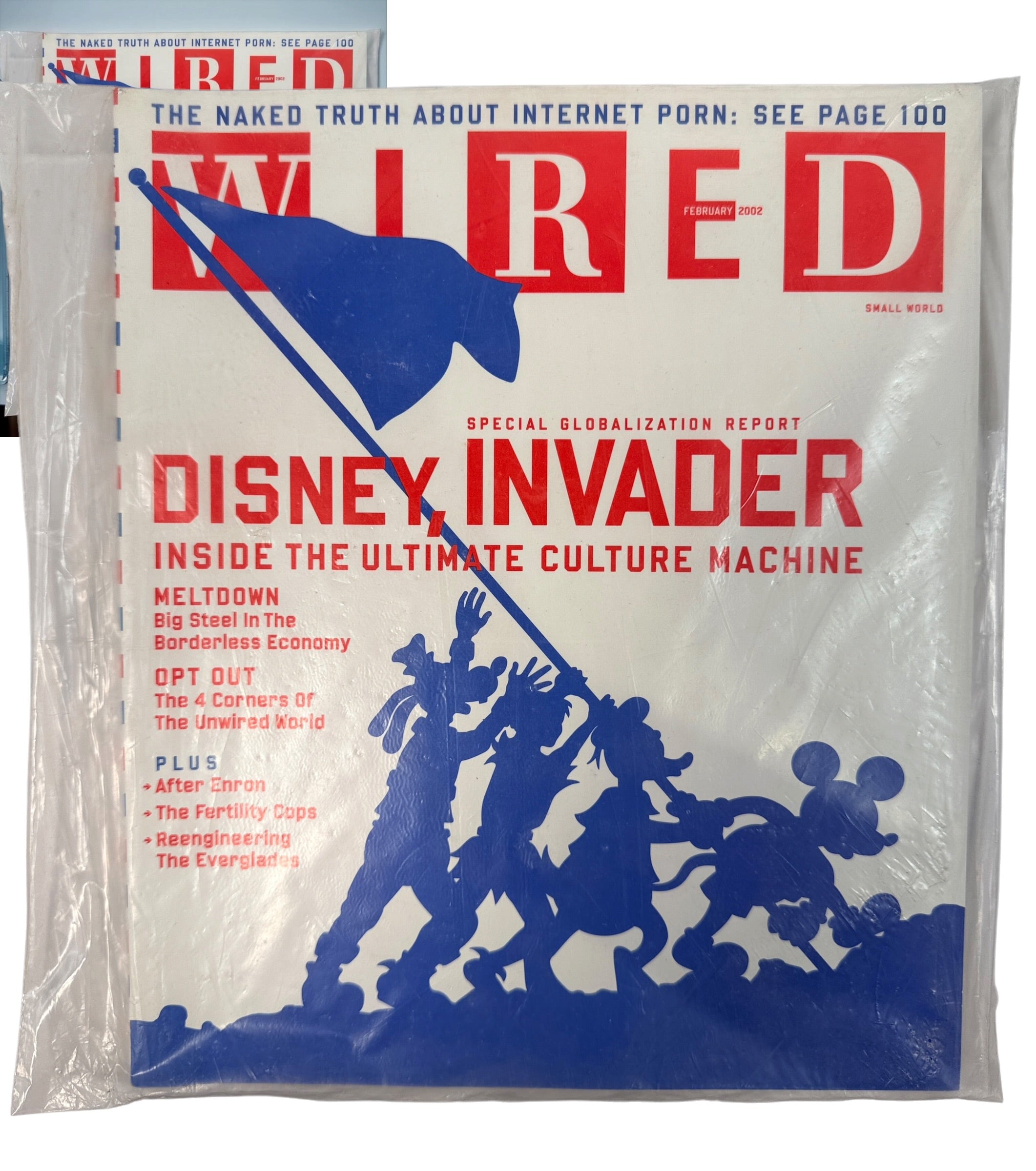 WIRED Magazine February 2002 featuring the Disney Invader globalization cover. Original vintage technology and culture magazine collectible.