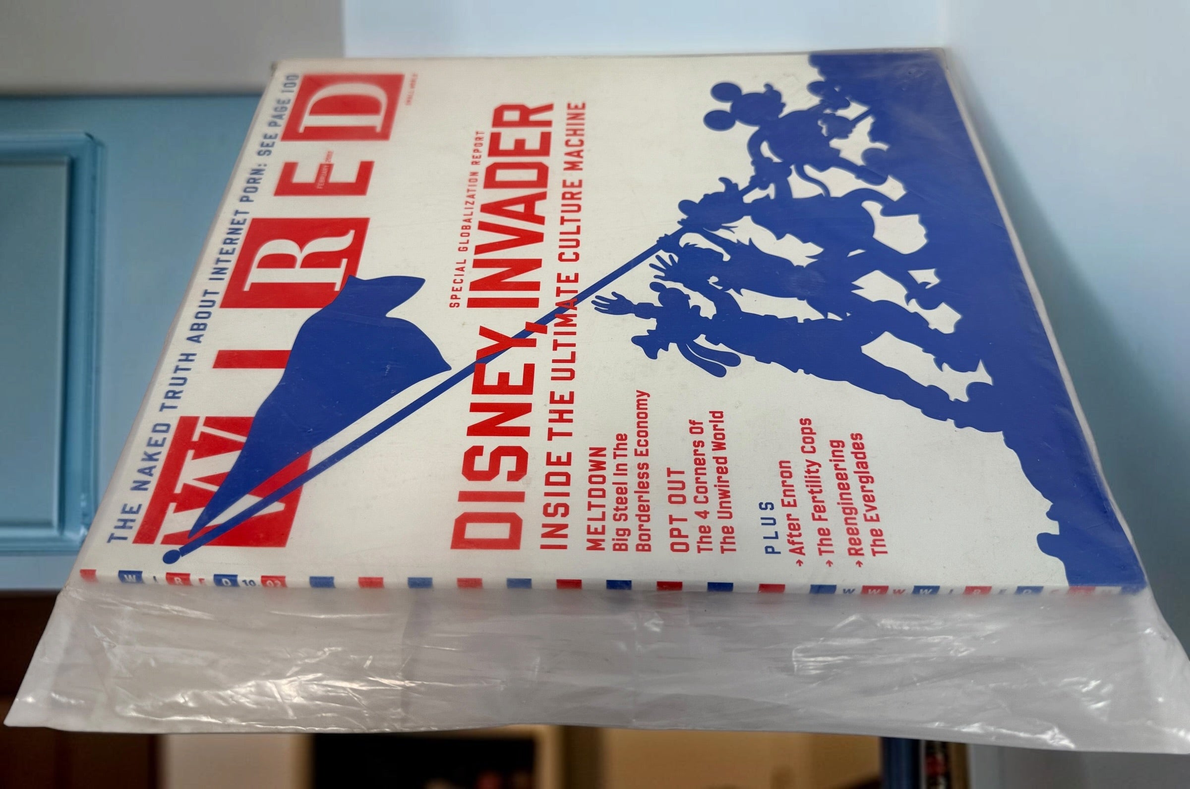 WIRED Magazine February 2002 featuring the Disney Invader globalization cover. Original vintage technology and culture magazine collectible.