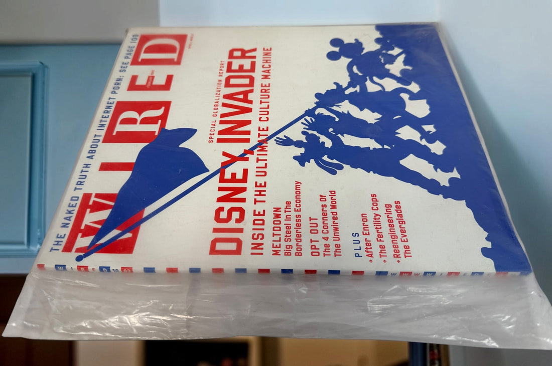 WIRED Magazine February 2002 featuring the Disney Invader globalization cover. Original vintage technology and culture magazine collectible.