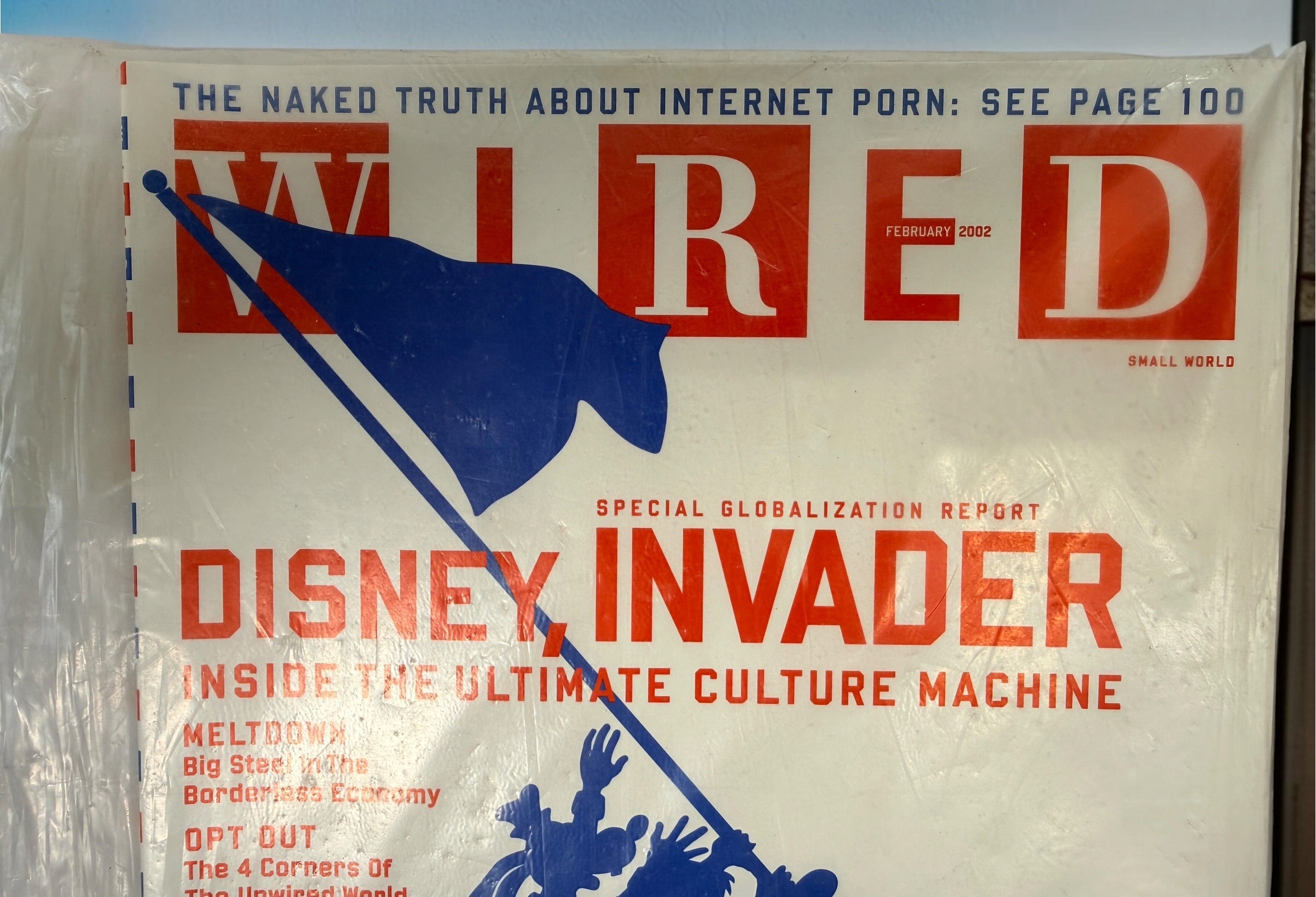 WIRED Magazine February 2002 featuring the Disney Invader globalization cover. Original vintage technology and culture magazine collectible.