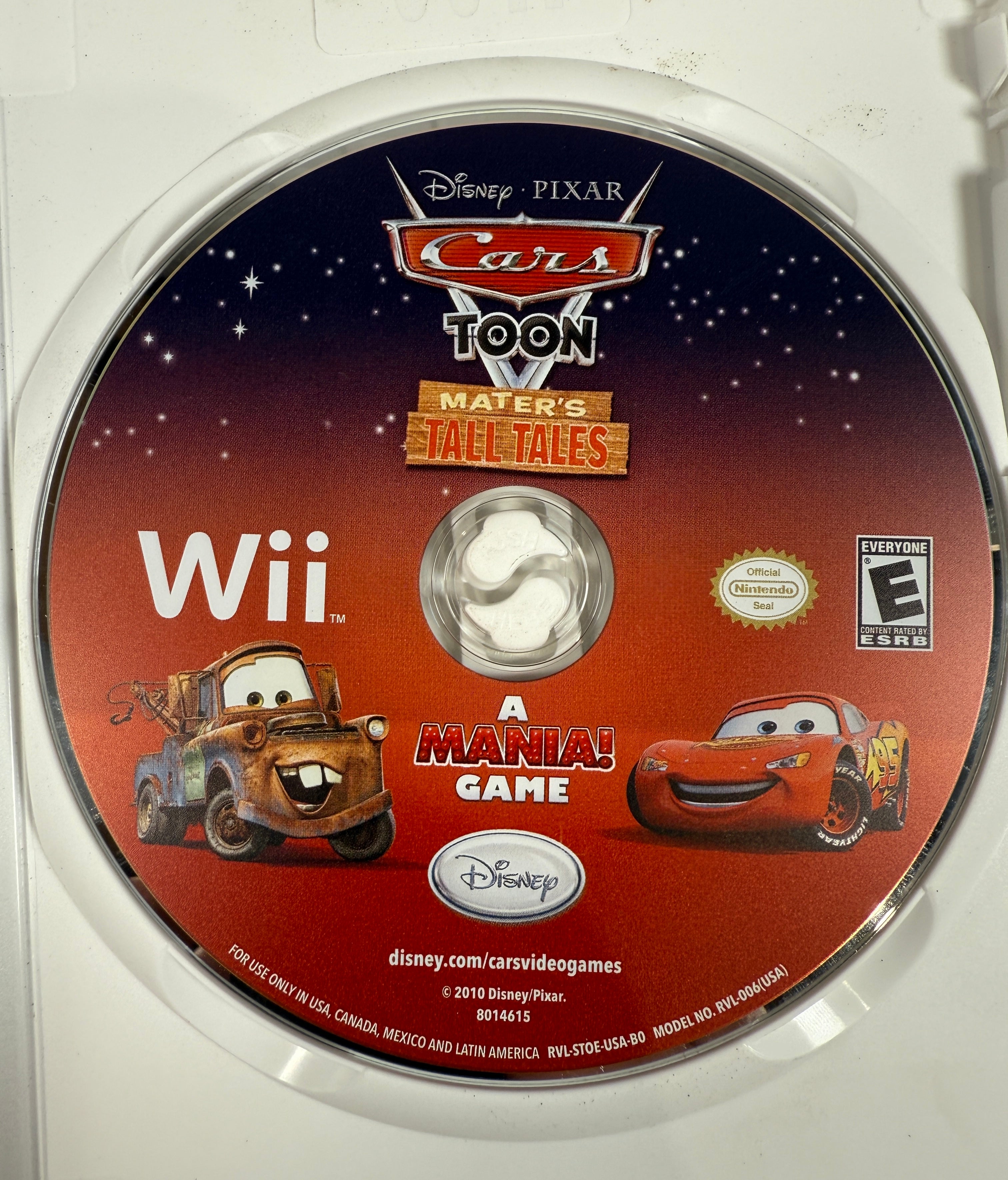 Wii game disc for 'Cars Toon: Mater's Tall Tales' with Disney and Pixar branding.