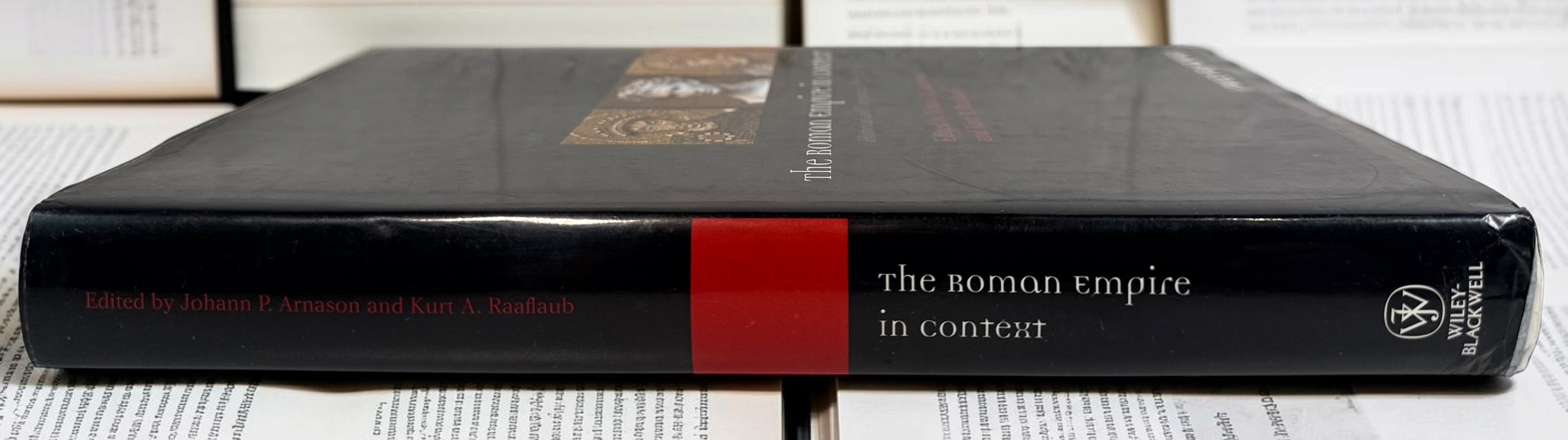 2011 first edition The Roman Empire in Context by Arnason &amp; Raaflaub. Wiley-Blackwell hardcover with dust jacket. Academic Roman history reference.