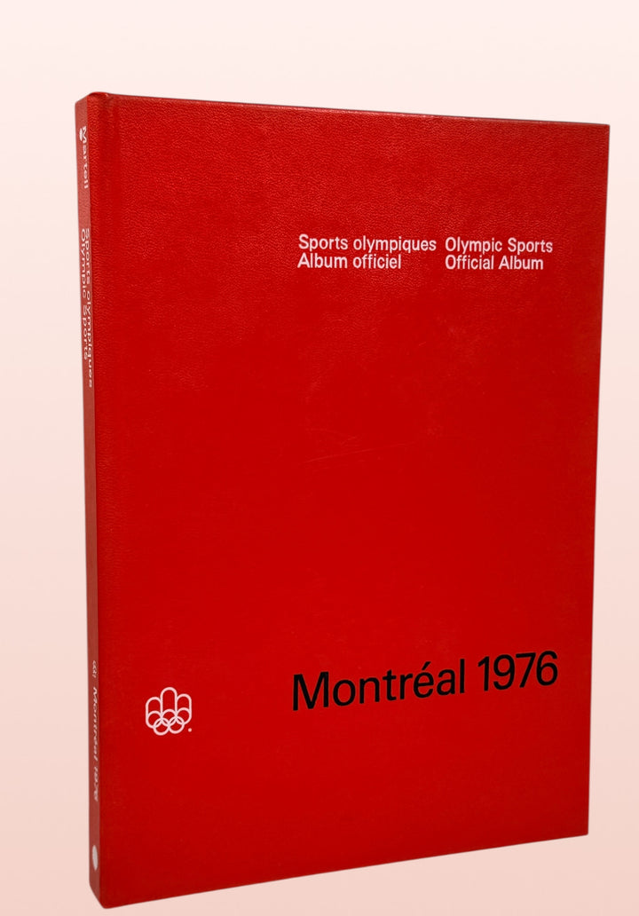 Official 1976 Montreal Olympics hardcover album bilingual Olympic sports reference book vintage Olympic memorabilia collectible Canada Games souvenir.