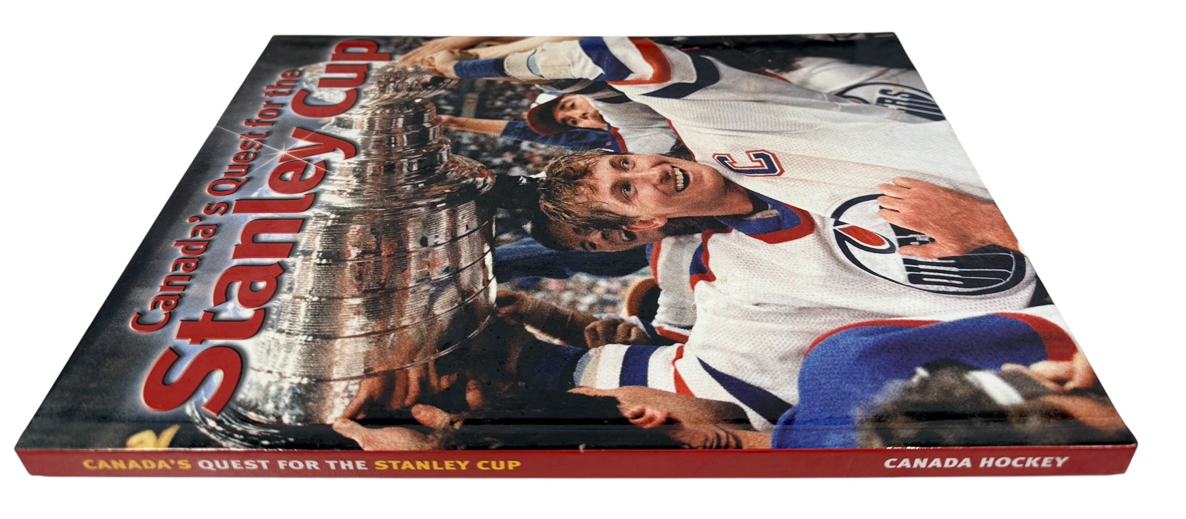 Vintage Stanley Cup hockey history book featuring iconic Canadian teams, archival photos and championship moments. Great sports collectible or gift.