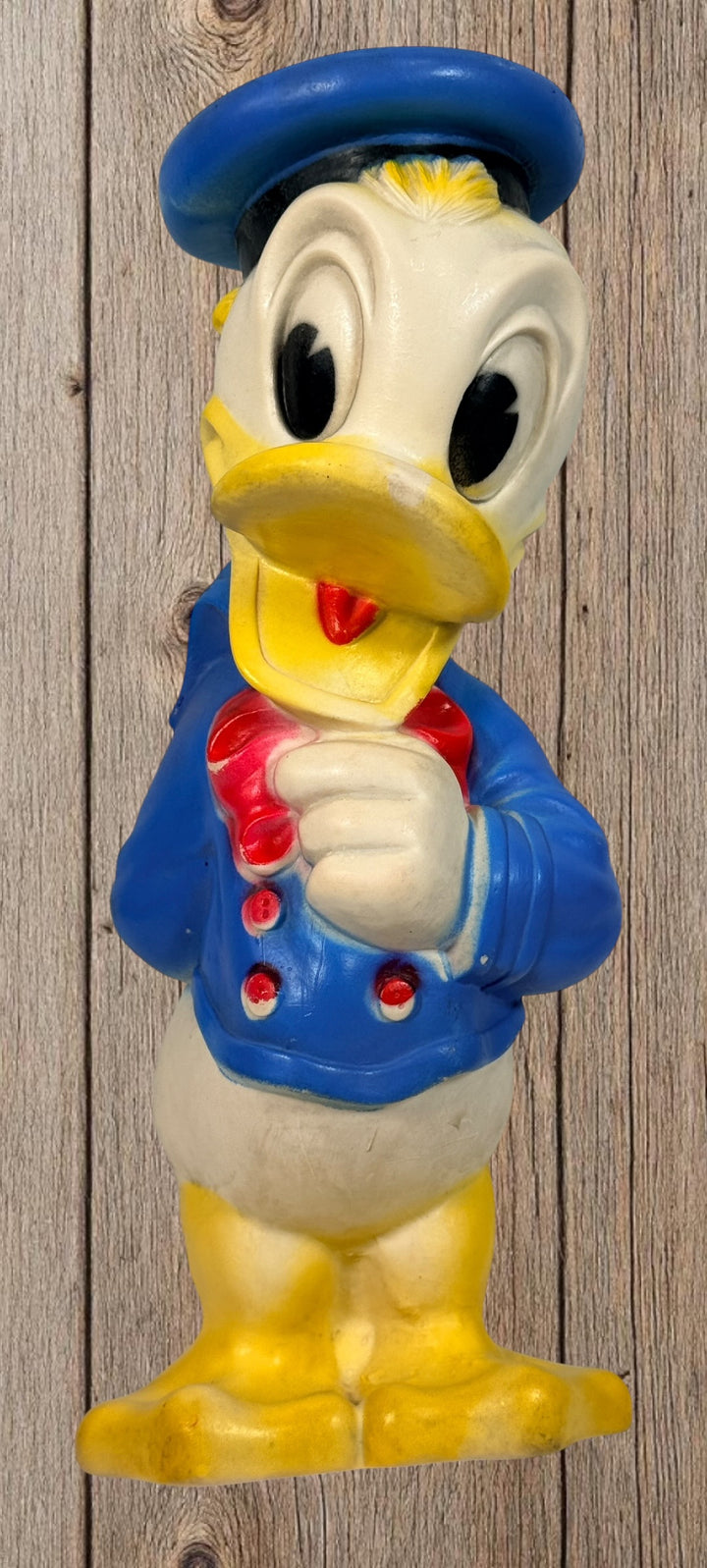 Vintage Donald Duck vinyl toy figure large retro Disney collectible decor piece 1960s style nostalgic character display figure for collectors or decor.
