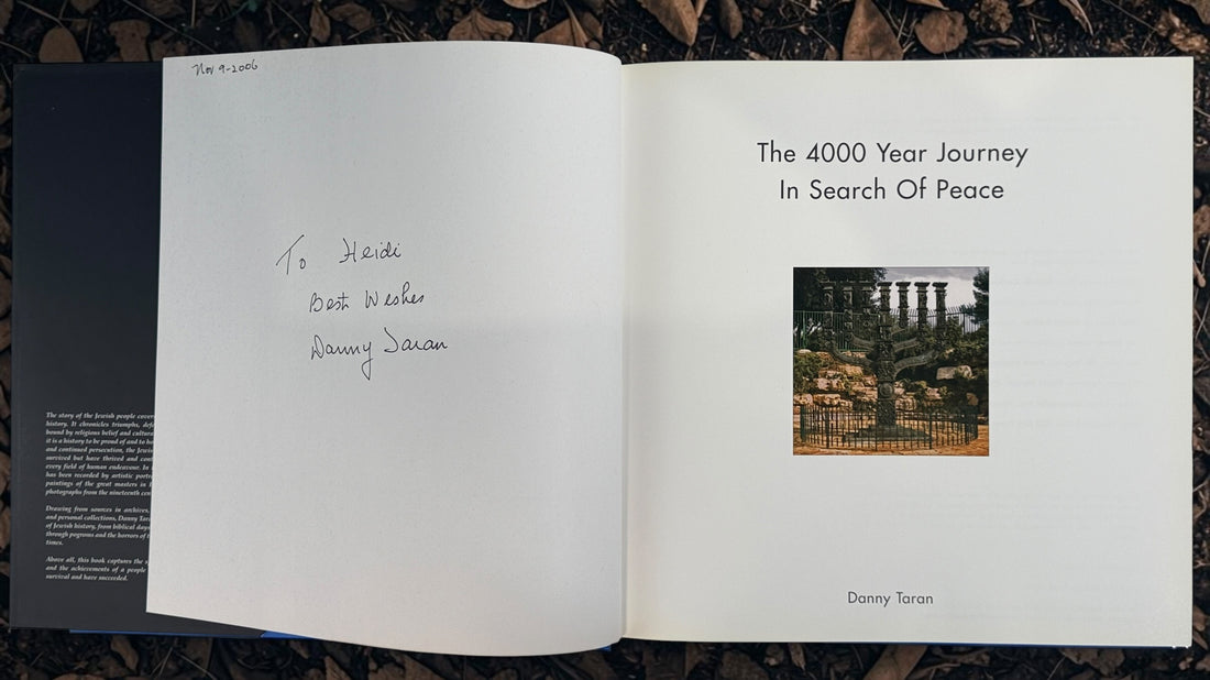 Signed 2006 first edition of Danny Taran’s The 4000 Year Journey: In Search of Peace. Inscribed hardcover exploring Jewish history through photography.