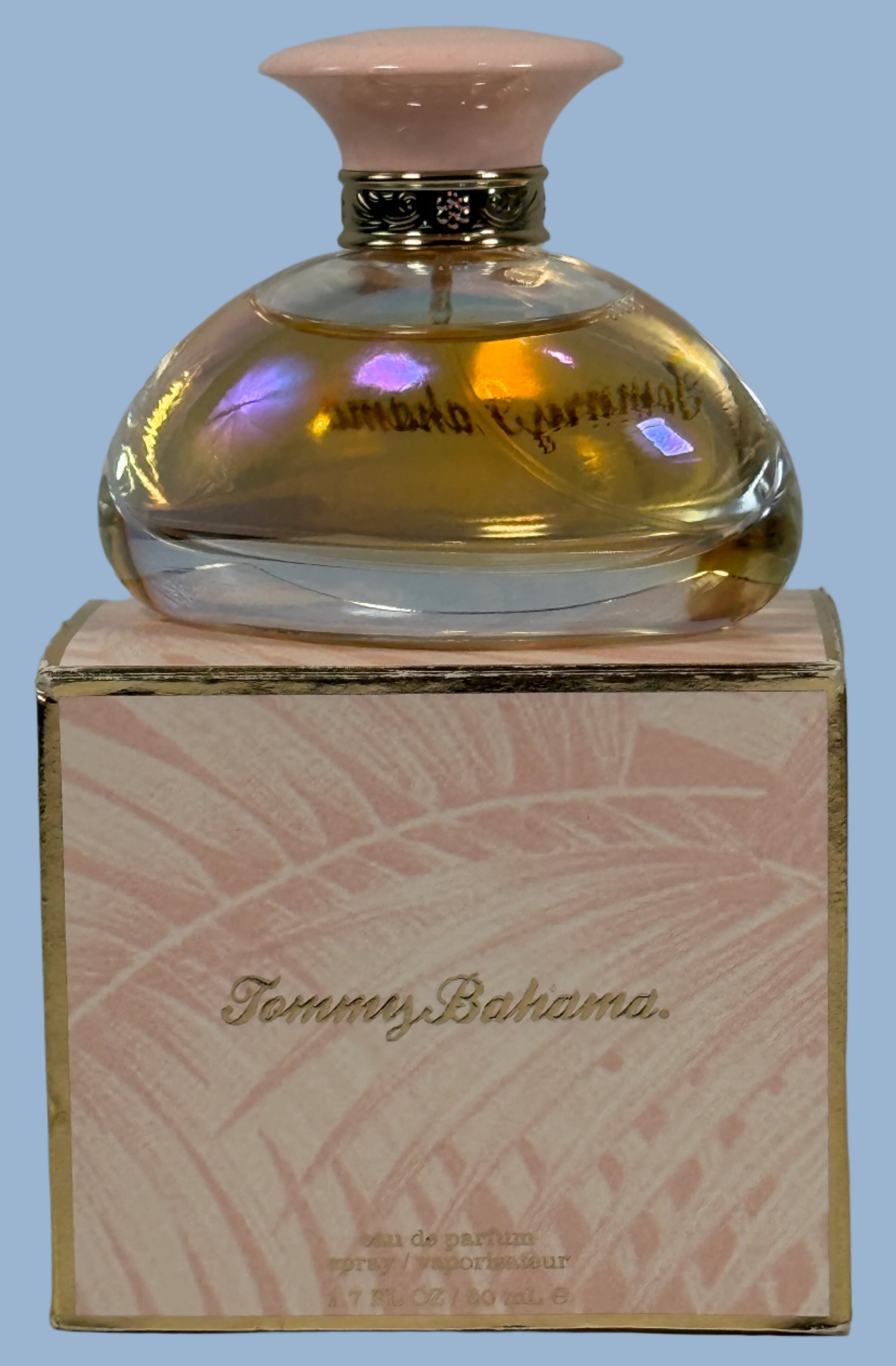 Tommy Bahama perfume bottle on its packaging with a light gray background