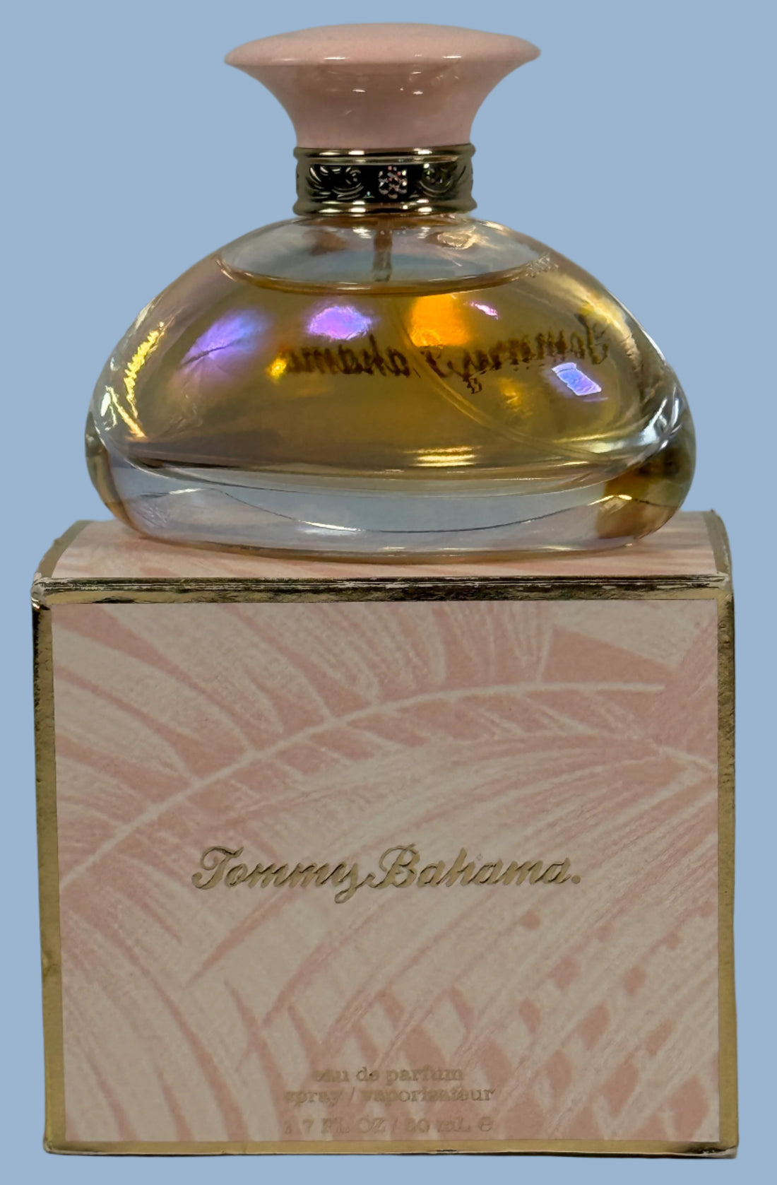 Tommy Bahama perfume bottle on its packaging with a light gray background