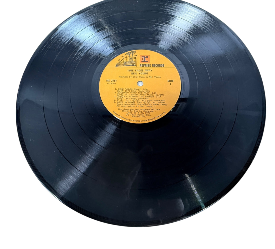 Original 1973 Neil Young Time Fades Away LP Canadian pressing with insert. Classic live-era vinyl album in VG condition, collectible Reprise Records issue.