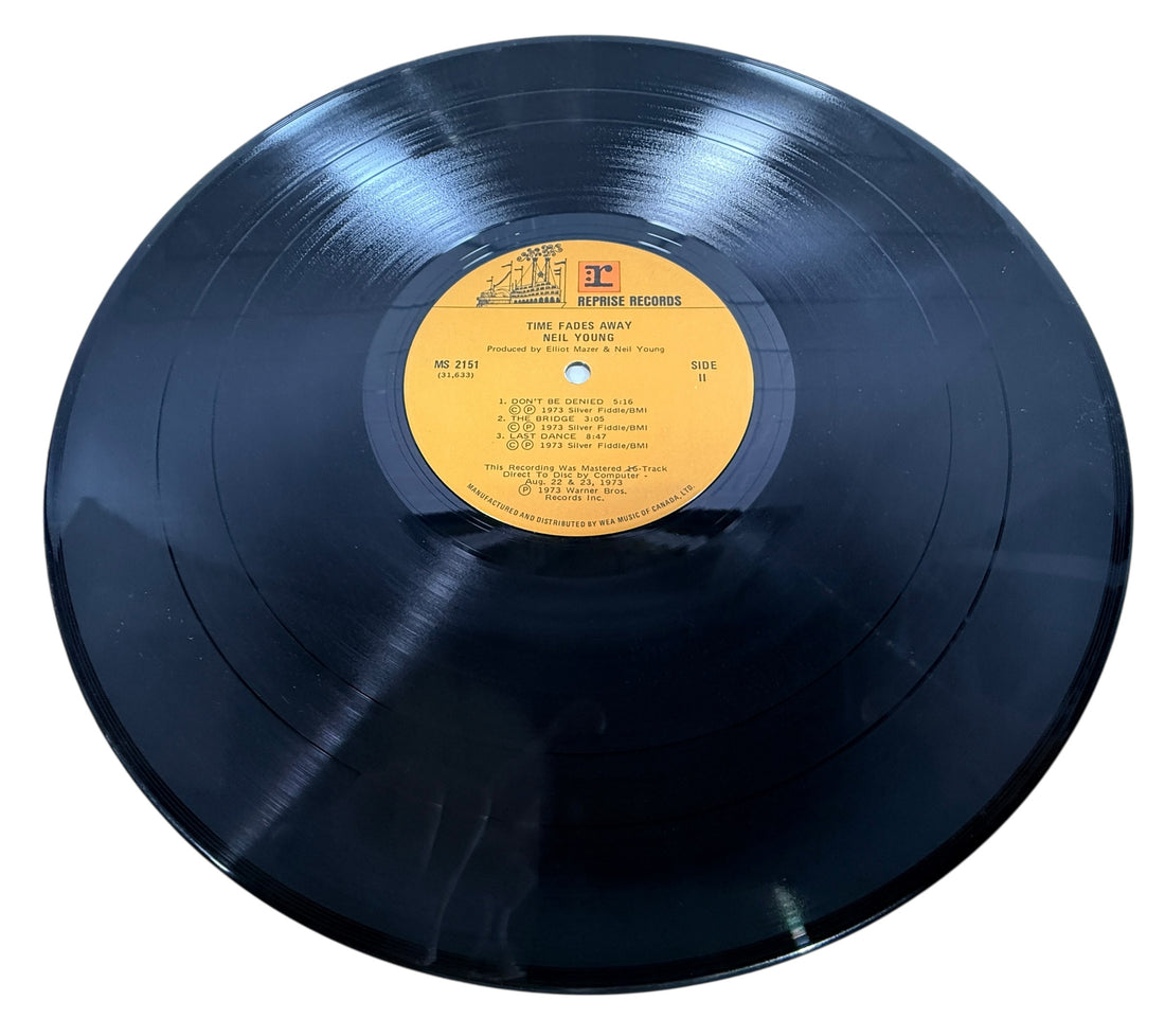 Original 1973 Neil Young Time Fades Away LP Canadian pressing with insert. Classic live-era vinyl album in VG condition, collectible Reprise Records issue.