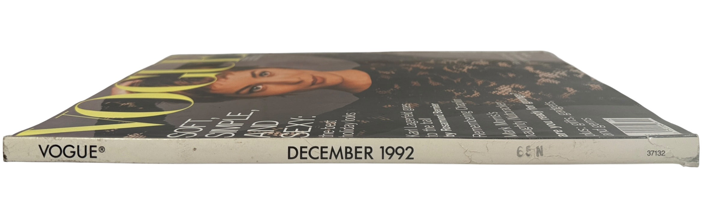 Vintage Vogue US December 1992 magazine featuring Lucie De La Falaise. Classic 90s fashion editorial issue with designer ads, beauty content and cultural features.