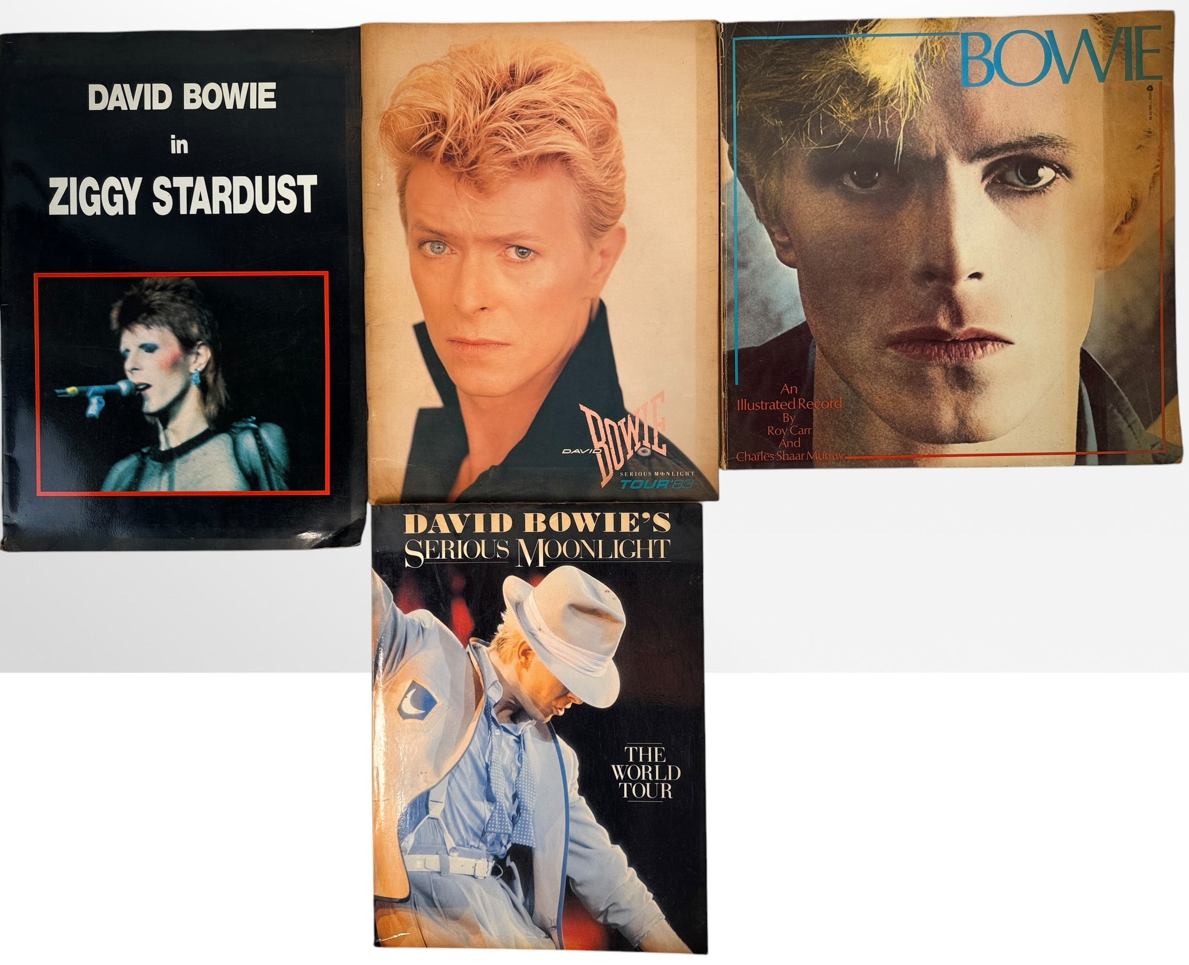 Vintage David Bowie 4-piece memorabilia lot with Japanese Ziggy Stardust program, 1983 Serious Moonlight tour programs and illustrated Bowie book.