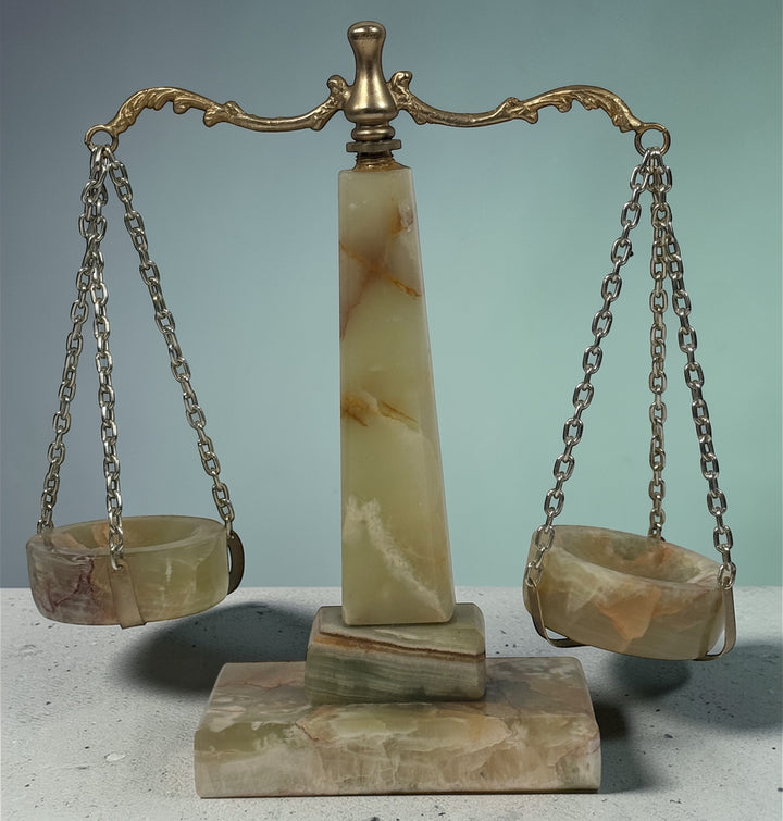 Vintage onyx marble justice scale with brass balance arms. Elegant legal office desk décor featuring natural stone veining. Decorative collectible display piece.