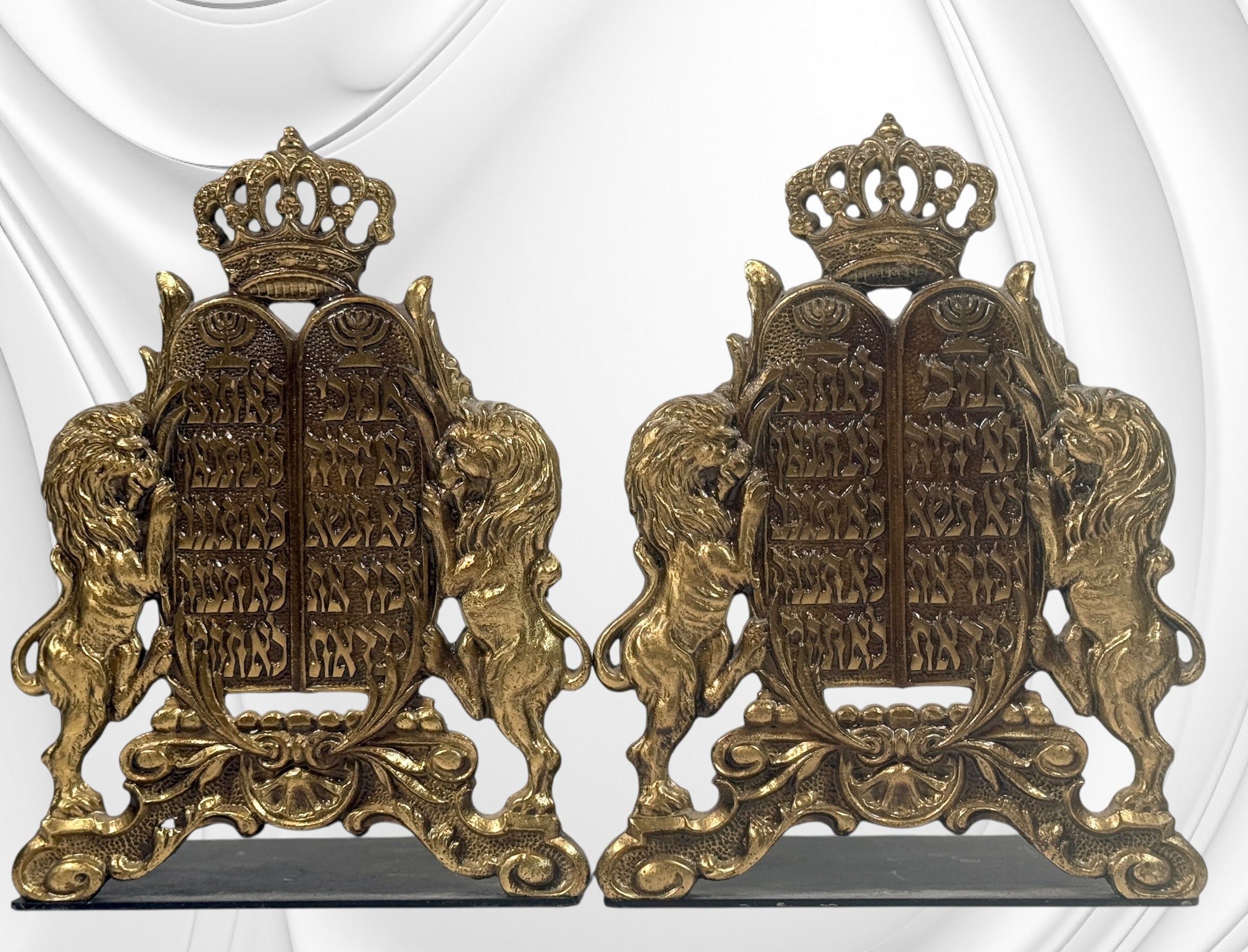 Vintage brass Judaica bookends from Israel with Ten Commandments tablets and lions. Solid decorative pair with classic religious symbolism and display appeal.