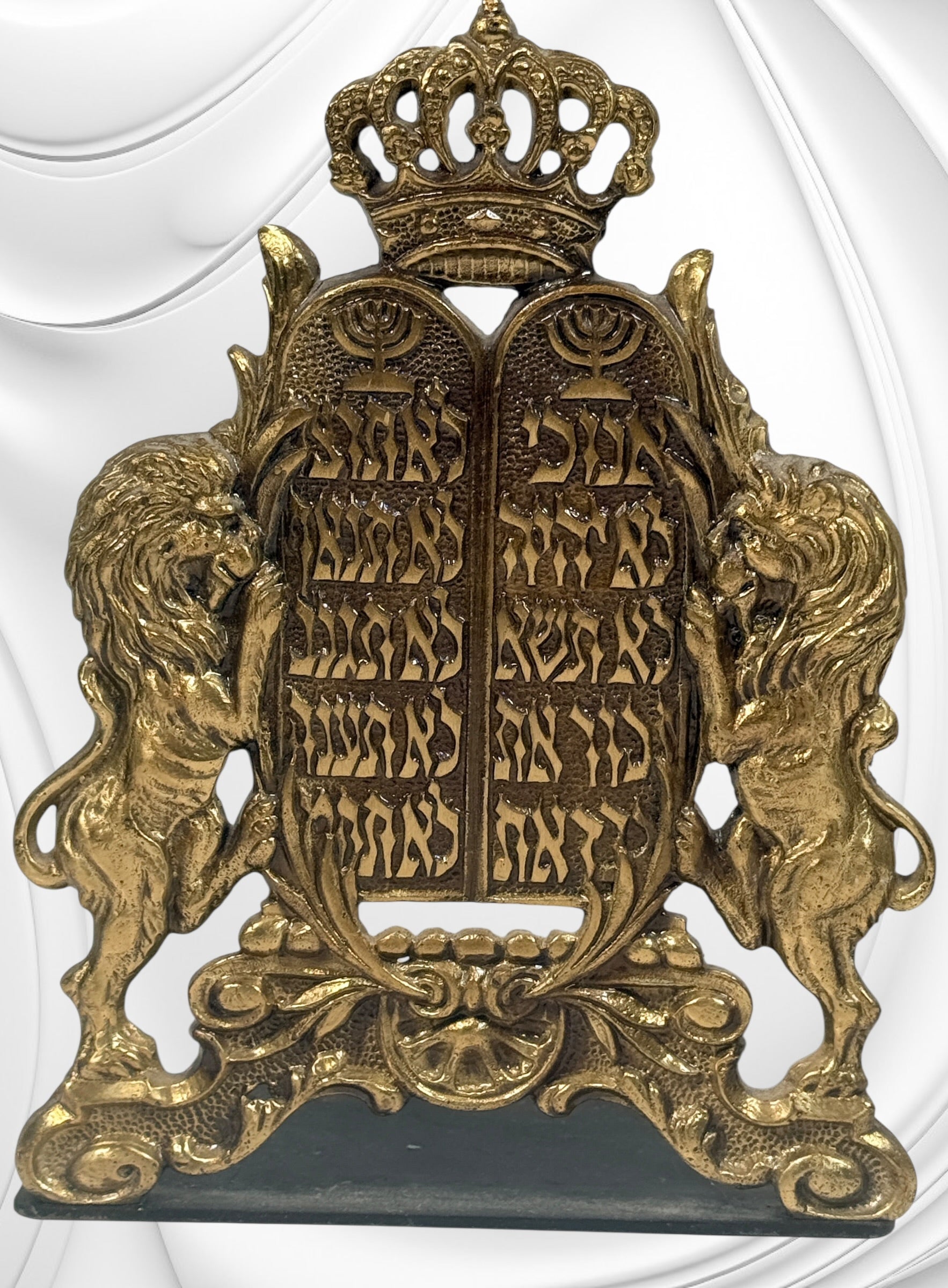 Vintage brass Judaica bookends from Israel with Ten Commandments tablets and lions. Solid decorative pair with classic religious symbolism and display appeal.