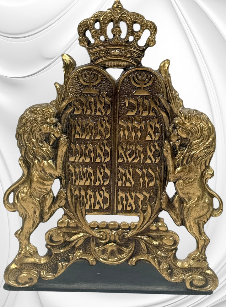 Vintage brass Judaica bookends from Israel with Ten Commandments tablets and lions. Solid decorative pair with classic religious symbolism and display appeal.