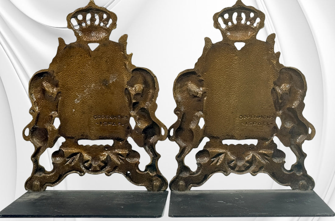 Vintage brass Judaica bookends from Israel with Ten Commandments tablets and lions. Solid decorative pair with classic religious symbolism and display appeal.
