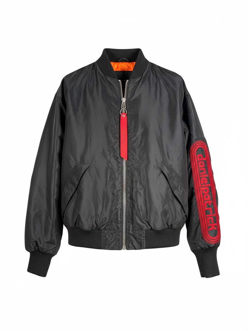 Daniel Patrick Los Angeles oversized black bomber jacket, size L, with orange lining, red embroidered sleeve logo and branded zipper pulls.