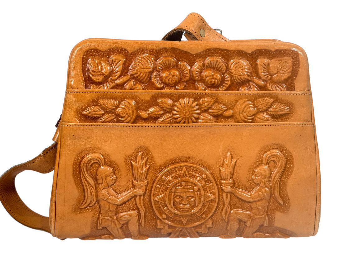 Vintage tooled leather handbag with Aztec motif. Mexican artisan carved shoulder purse, structured boho accessory with strong vintage character and collector appeal.