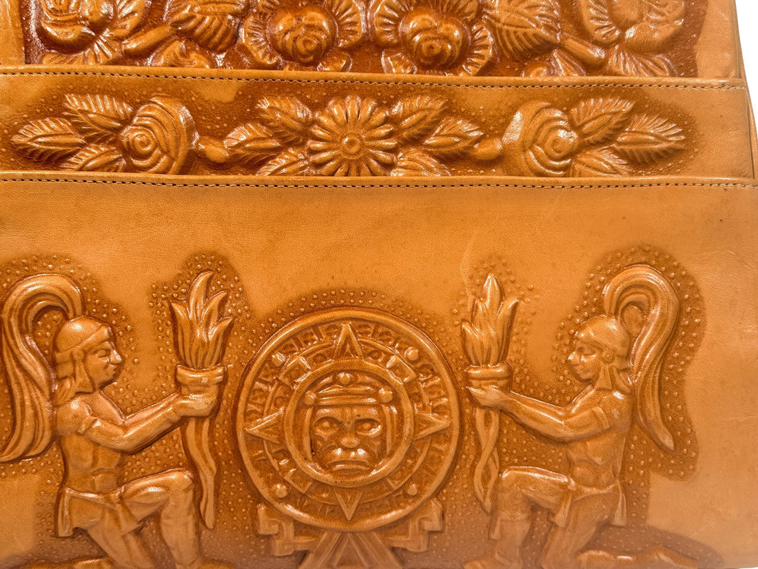 Vintage tooled leather handbag with Aztec motif. Mexican artisan carved shoulder purse, structured boho accessory with strong vintage character and collector appeal.